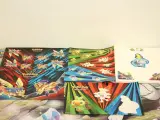 Groot Pokémon verzamel lot – TCG kaarten, tins, Pikachu knuffel, DVD’s, Pokémon GO & accessoires – foto 5 – kavel bij De Kringwinkel, Antwerpen
