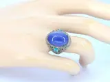Grote ovaal gevormde ring met een tanzaniet, topazen, smaragden en natuurlijke diamanten – foto 2 – kavel bij Onlineveilingmeester