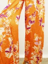 Rae Antwerp elegante soepelvallende oranje damesbroek met bloemenprint – foto 4 – kavel bij De Kringwinkel, Antwerpen