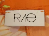 Rae Antwerp elegante soepelvallende oranje damesbroek met bloemenprint – foto 8 – kavel bij De Kringwinkel, Antwerpen