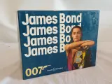 Collectie James Bond boeken in doos – foto 4 – kavel bij De Kringwinkel, Oudenaarde
