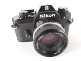 Vintage Nikon EM 35mm spiegelreflexcamera met Nikkor 50mm f/1.8-objectief – kavel bij De Kringwinkel, Heverlee