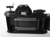 Vintage Nikon EM 35mm spiegelreflexcamera met Nikkor 50mm f/1.8-objectief – foto 4 – kavel bij De Kringwinkel, Heverlee