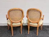 Set van 2 vintage rotan stoelen met armleuning – foto 4 – kavel bij De Kringwinkel, Turnhout