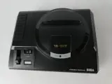 Sega Mega Drive 16-Bit – console met controller, kabels en gamecartridge – foto 2 – kavel bij De Kringwinkel, Heverlee