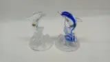 Set van 4 Cristal d'Arques kristallen dolfijnen beeldjes – foto 2 – kavel bij De Kringwinkel, Zottegem