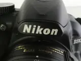 Nikon D3100 spiegelreflexcamera met accessoires en tas – foto 3 – kavel bij De Kringwinkel, Heverlee