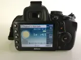 Nikon D3100 spiegelreflexcamera met accessoires en tas – foto 6 – kavel bij De Kringwinkel, Heverlee