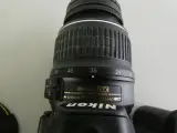 Nikon D3100 spiegelreflexcamera met accessoires en tas – foto 8 – kavel bij De Kringwinkel, Heverlee