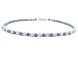 Witgouden tennisarmband met diamanten en robijnen – kavel bij Onlineveilingmeester