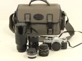 Canon AE-1 spiegelreflexcamera met lenzen en toebehoren – kavel bij De Kringwinkel, Antwerpen