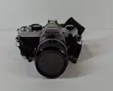 Nikon FM analoge spiegelreflexcamera met lens en draagriem – kavel bij De Kringwinkel, Geraardsbergen