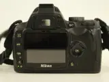 Nikon digitale D60 spiegelreflexcamera met lens, lader en draagtas – foto 8 – kavel bij De Kringwinkel, Antwerpen