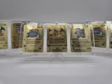 3x Metalen Venusaur, Charizard en Blastoise (Base Set) Pokémon kaarten in acryl display – kavel bij Onlineveilingmeester, Groningen
