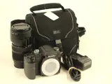 Sony Alpha 100 digitale spiegelreflexcamera met zoomlens en accessoires – kavel bij De Kringwinkel, Antwerpen