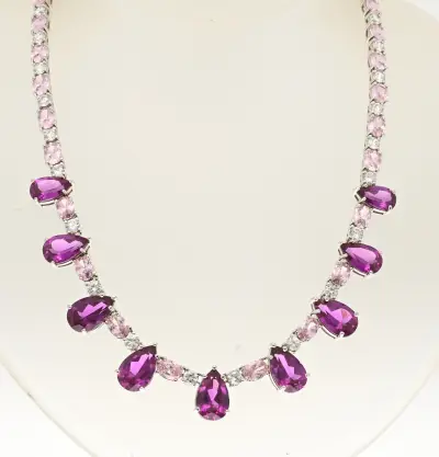 Zilveren choker met roze zirconia's – kavel bij Twents Veilinghuis