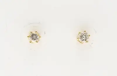 Gouden oorknoppen met diamant – kavel bij Twents Veilinghuis