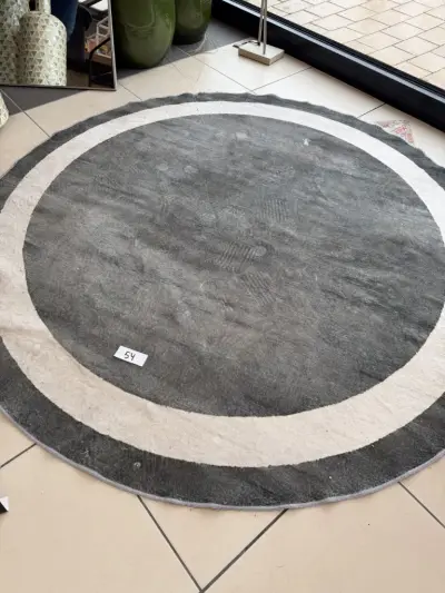 Rond groen tapijt – kavel bij Openbare Verkopen, Blankenberge