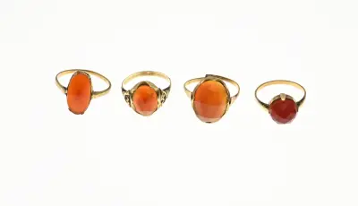 Lot met 4 ringen met carneool – kavel bij Twents Veilinghuis