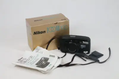 Nikon Zoom 100 – kavel bij De Kringwinkel, Brecht