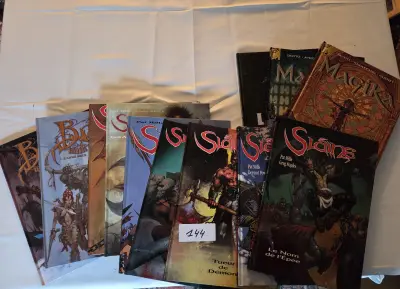 Set van diverse stripboeken uit de reeks Sláine van Pat Mills, waaronder Tueur de Démon en Le Nom de l'Épée – Lot 144 – kavel bij Goeiendeal, Jette
