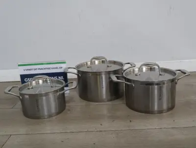 Herman RVS kookpannen set met deksels – kavel bij GSD Auctions, Zoeterwoude