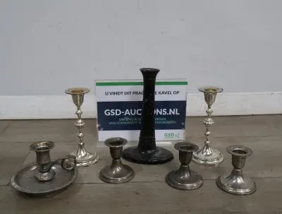 Set van 7 zilverkleurige kandelaars – kavel bij GSD Auctions, Zoeterwoude