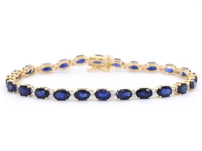 Gouden tennisarmband met diamanten en saffier – kavel bij Onlineveilingmeester