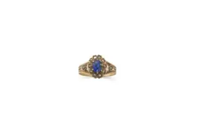 Bague marguerite en or jaune 18k (750°/°°) centrée d'un saphir bleu ovale d'environ 0,5… – kavel bij Galerie Moderne, Elsene (Brussel)