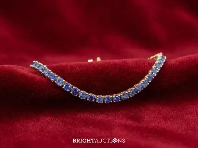 Gouden tennisarmband met natuurlijke saffieren – kavel bij Bright Auctions, Netherlands