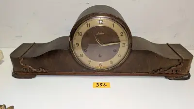 Een houten schoorsteenklok van JUNGHANY – kavel bij Auctionline, Anderlecht