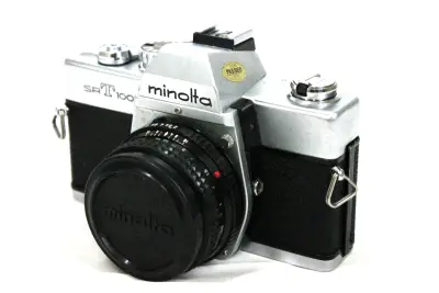 Minolta SR-T 100X Spiegelreflexcamera – kavel bij De Kringwinkel, Brecht