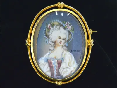 Gouden broche met bijzonder portret – kavel bij Onlineveilingmeester