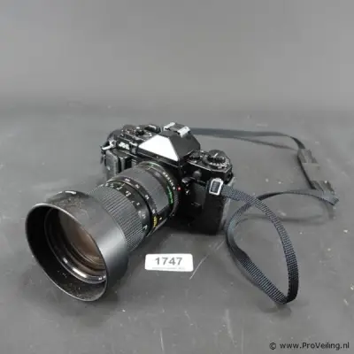 Canon A-1 spiegelreflexcamera uitgerust met een Canon New FD 35-105mm f/3.5 zoomlens – kavel bij ProVeiling
