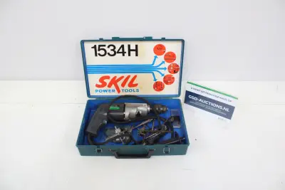 Skil 1534H elektrische boormachine met accessoires – kavel bij GSD Auctions, Zoeterwoude