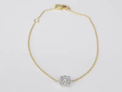 Gouden armband met een diamanten bedel – kavel bij Onlineveilingmeester