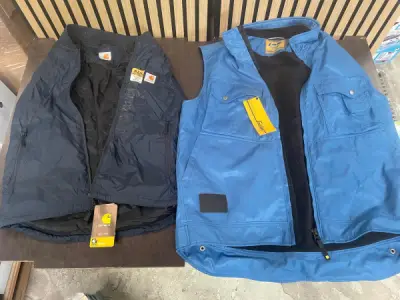 Set van 2 Werkvesten – Carhartt & Snickers – kavel bij XL Auctions