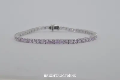 Witgouden tennisarmband met roze natuurlijke saffieren – kavel bij Bright Auctions