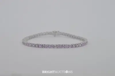 Witgouden tennisarmband met roze natuurlijke saffieren – kavel bij Bright Auctions