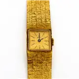 EBEL, geelgouden dames dress watch met vierkante kast, goudkleurige wijzerplaat met zwarte wijzers en indexen, aan gematteerde geelgouden band met… – kavel bij Venduhuis De Eland