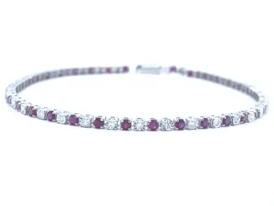 Witgouden tennisarmband met diamanten en robijnen – kavel bij Onlineveilingmeester