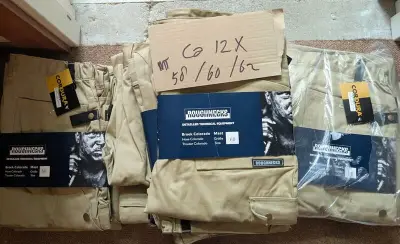 Ca. 12x Werkbroek Roughnecks, beige, Maten 58, 60 en 62 – kavel bij Onlineveilingmeester