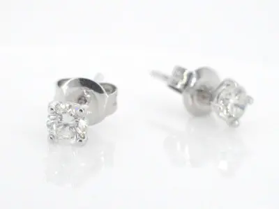 Charles Greig - Gouden solitair oorbellen met diamanten – kavel bij Onlineveilingmeester