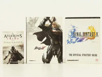 Lot van 3 gamingboeken – SoulCalibur - Final Fantasy - Assassin’s Creed – kavel bij De Kringwinkel, Antwerpen