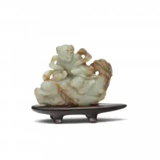 China, a celadon jade 'boy and carp' group, Qing dynasty (1644-1912) – kavel bij Veilinggebouw De Zwaan, Amsterdam