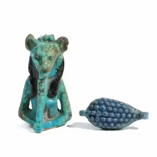 Egypt, a blue faience amulet in the shape of a bunch of grapes and a part of a fine Sechmet amulet, 18th Dynasty - 21st Dynasty – kavel bij Veilinggebouw De Zwaan, Amsterdam