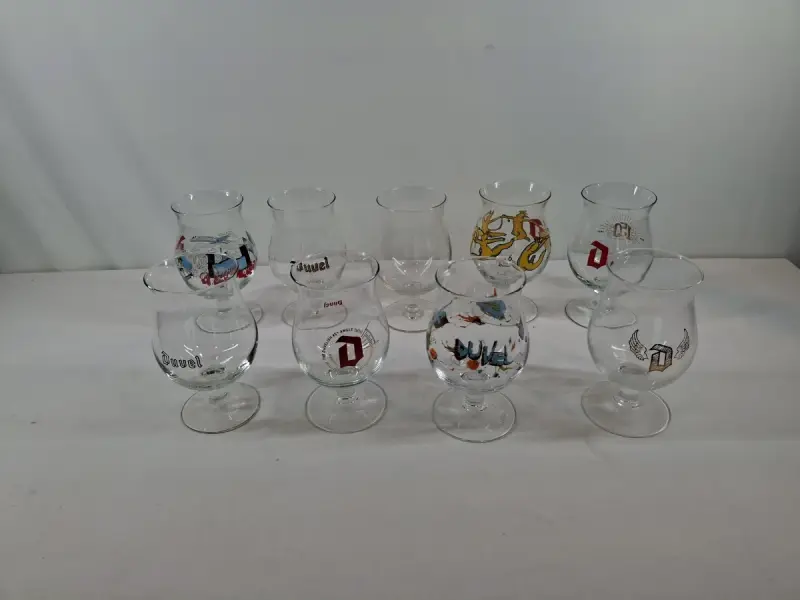 Set van 9 Duvel bierglazen met diverse opdrukken – kavel bij De Kringwinkel, Oudenaarde