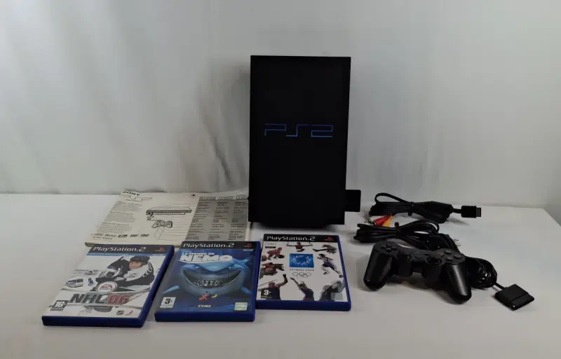 PlayStation 2 console met originele doos, 3 spellen en accessoires – kavel bij De Kringwinkel, Zottegem