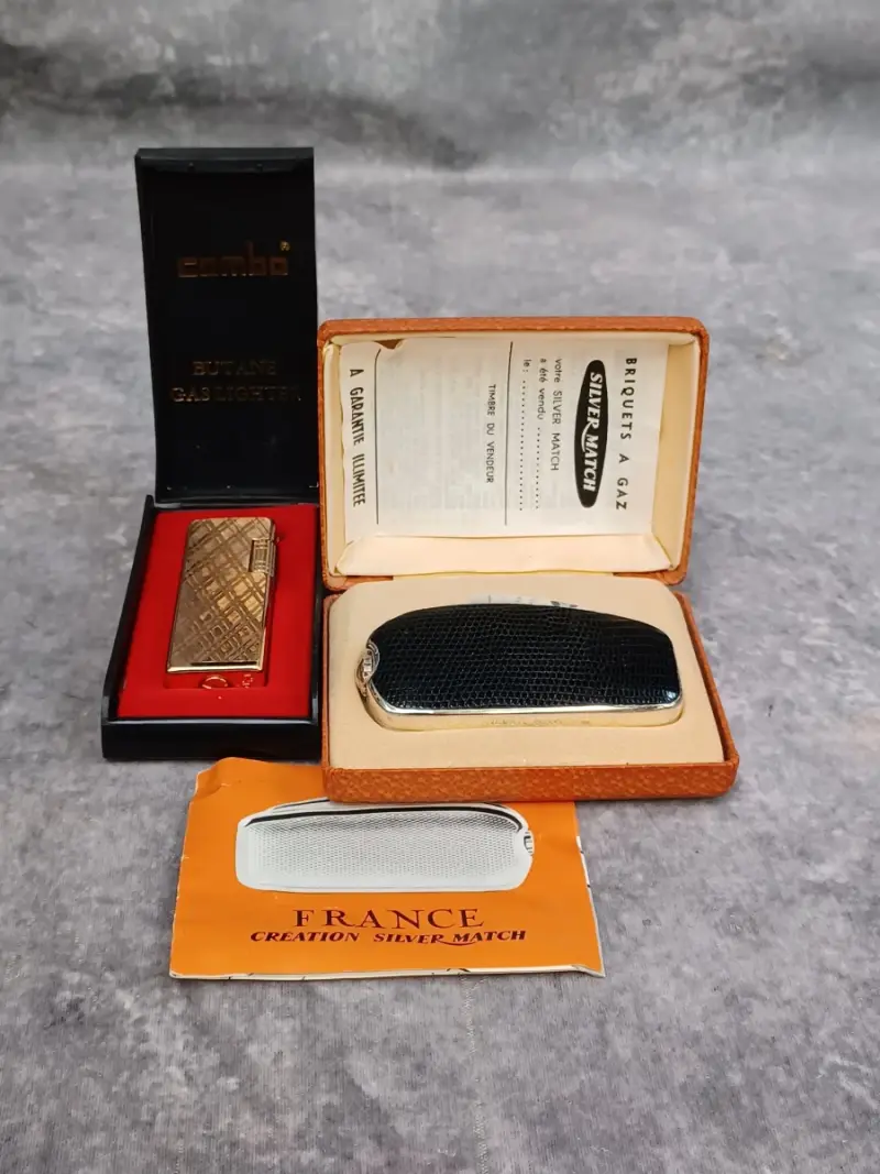 Set van 2 vintage gasaanstekers: Silver Match en Champ – kavel bij De Kringwinkel, Gent